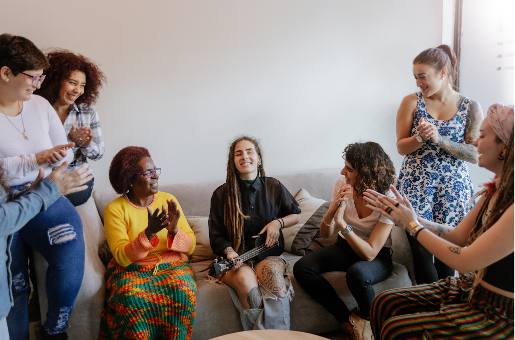 group of diverse individuals having a conversation in a room